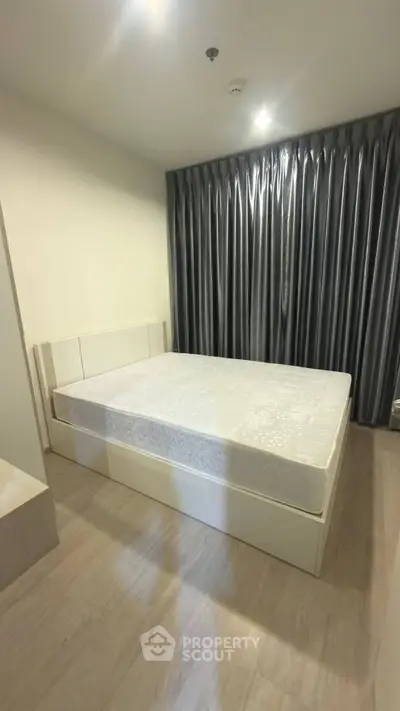 Modern bedroom with sleek design and elegant curtains