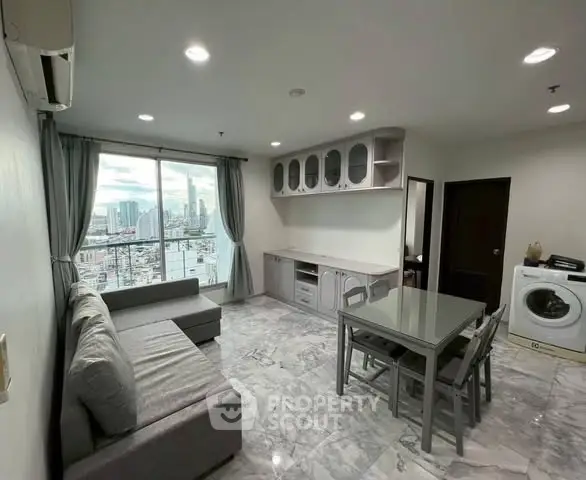 Modern living room with city view, sleek furniture, and marble flooring.