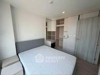 Modern bedroom with built-in storage and minimalist design