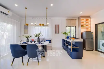 Modern open-plan kitchen and dining area with stylish decor and natural light