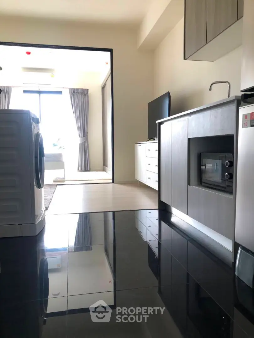 Modern apartment kitchen with sleek appliances and open layout