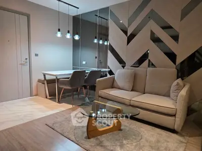 Modern living room with stylish decor and elegant dining area