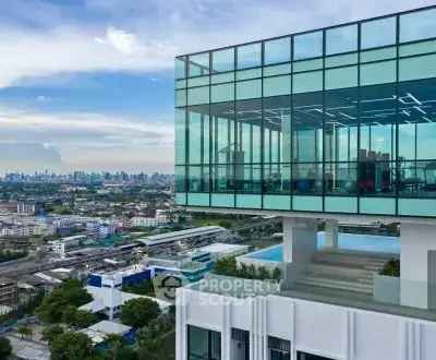 Stunning modern building with panoramic city views and glass facade.
