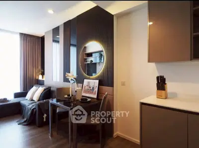 Modern living room with elegant decor and stylish furniture, featuring a cozy dining area and ambient lighting.