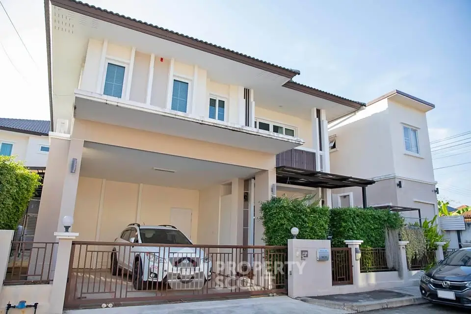 Modern two-story house with spacious driveway and sleek design