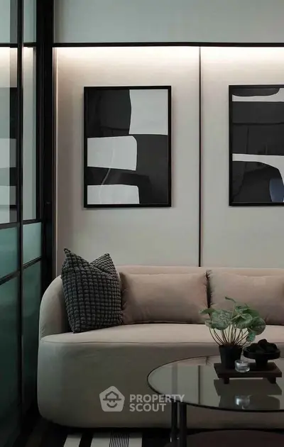 Modern living room with stylish sofa and abstract art decor