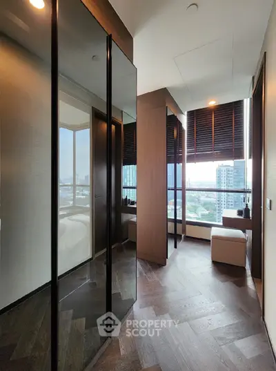 Luxurious modern bedroom with floor-to-ceiling windows and stunning city view