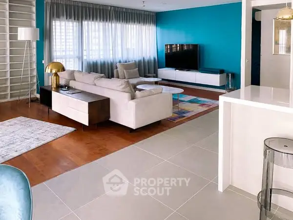 Spacious modern living room with stylish decor and large windows