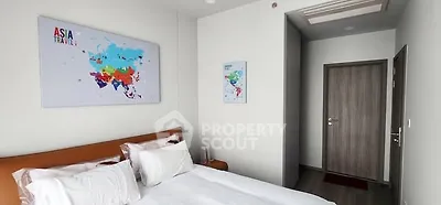 Modern bedroom with stylish decor and world map art on the wall.