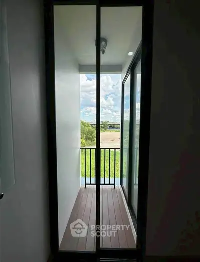 Charming small balcony with scenic view, perfect for relaxation and enjoying the outdoors.