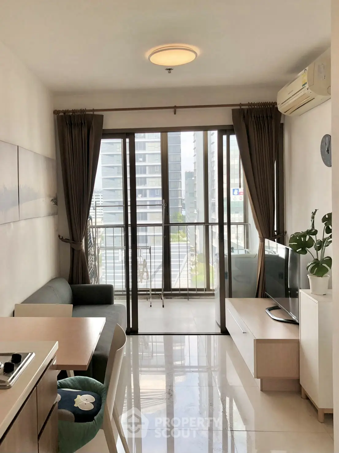Modern living room with balcony view in high-rise apartment