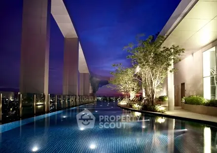 Luxurious rooftop pool with stunning cityscape views at twilight.