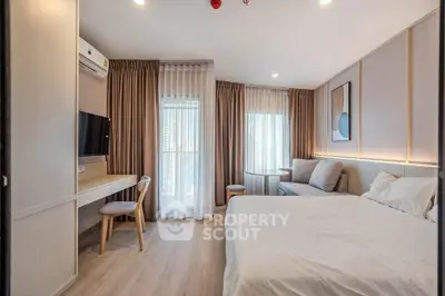 Modern bedroom with stylish decor, featuring a cozy bed, elegant curtains, and a sleek workspace.