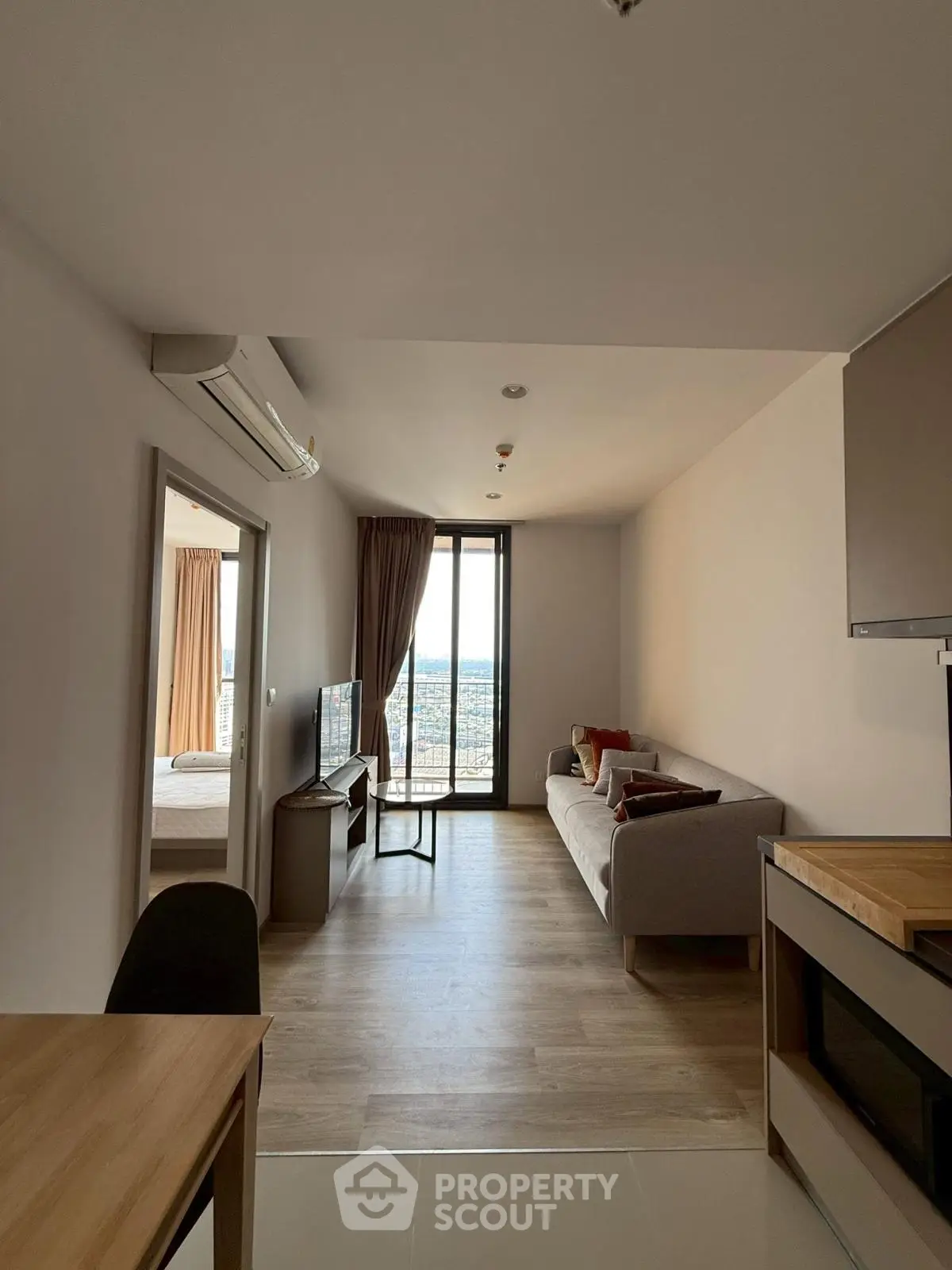 Modern living room with sleek design and stunning city view