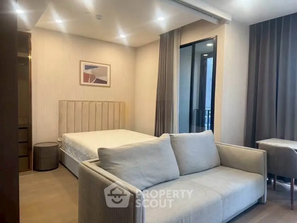 Modern studio apartment with cozy living area and stylish decor