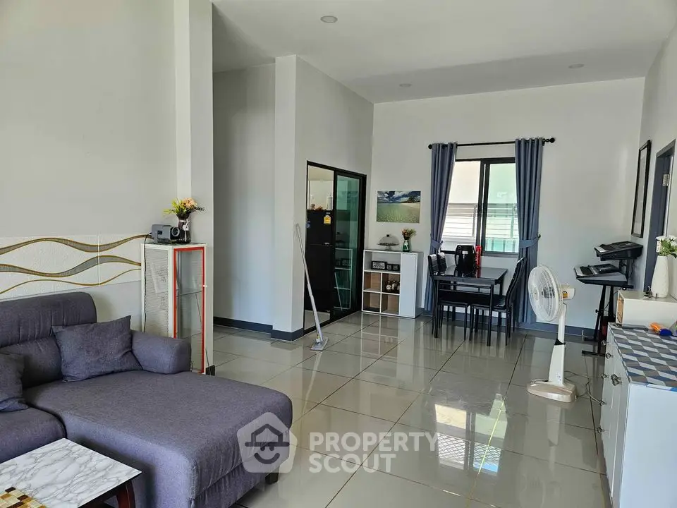 Spacious living room with modern decor and natural light