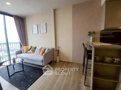 Modern living room with cozy sofa and stylish decor in a high-rise apartment.