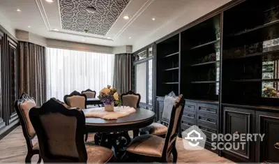 Luxurious dining room with elegant furniture and intricate ceiling design