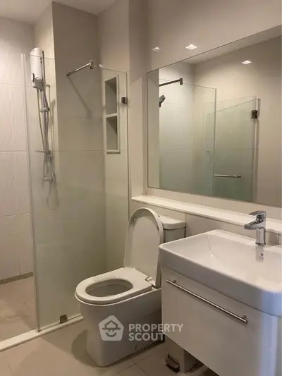 Modern bathroom with glass shower and sleek fixtures