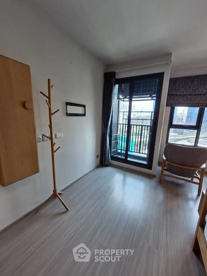 Modern apartment interior with balcony view and stylish furniture