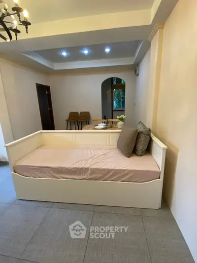 Cozy living room with stylish daybed and elegant decor