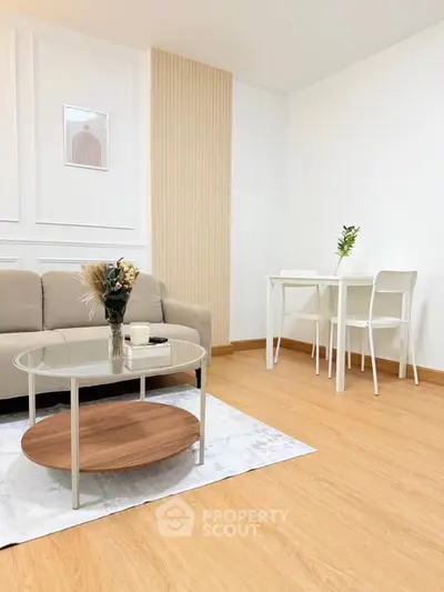 Modern living room with stylish furniture and elegant decor, featuring a cozy sofa and chic coffee table.