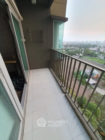 Spacious balcony with city view in modern apartment