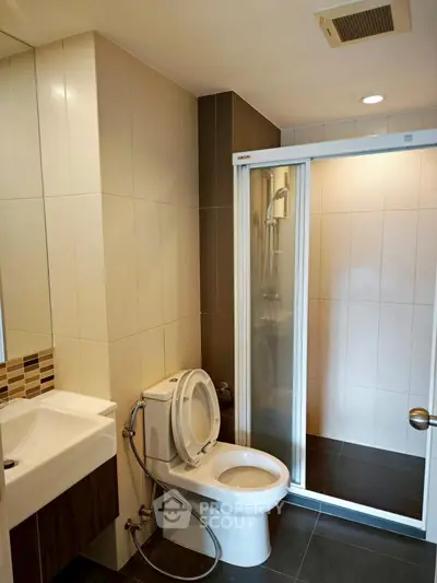 Modern bathroom with sleek shower and contemporary fixtures