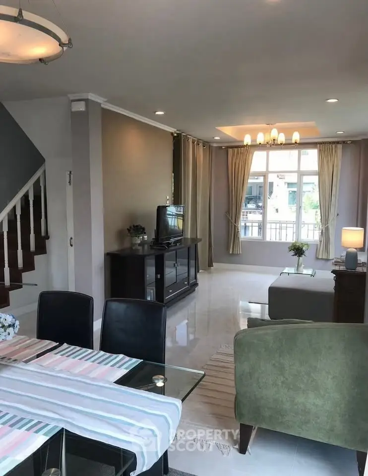 Spacious living room with elegant decor and natural light