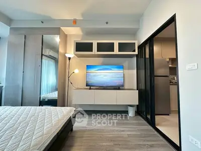 Modern bedroom with sleek design and open kitchen view