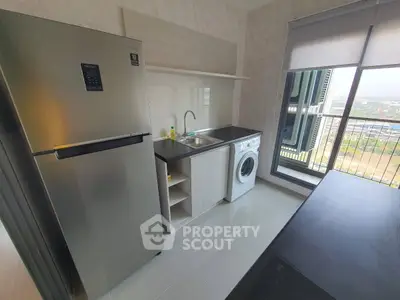 Modern kitchen with sleek appliances and stunning city view