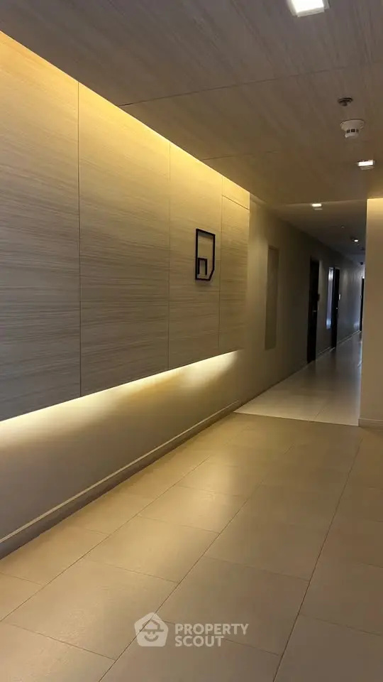 Modern corridor with elegant lighting and sleek design in a contemporary building.