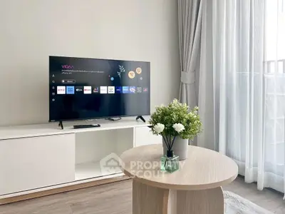 Modern living room with sleek TV setup and elegant decor