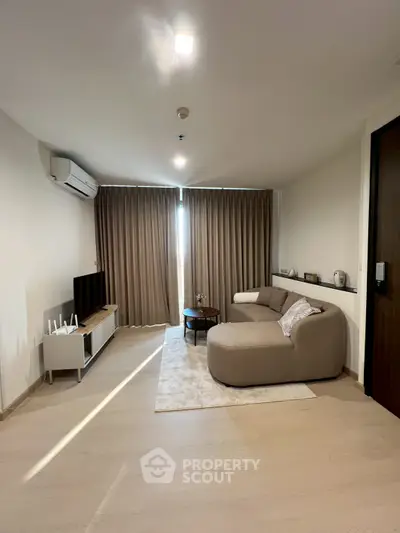 Modern living room with stylish furniture and natural light