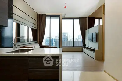Luxurious modern living room with open kitchen and stunning city view
