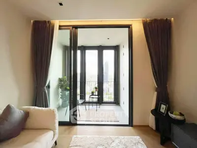 Modern living room with balcony view, featuring elegant curtains and cozy seating area.