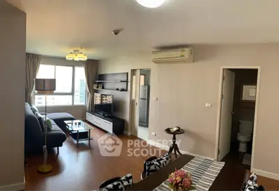 Spacious modern living room with dining area and large window view