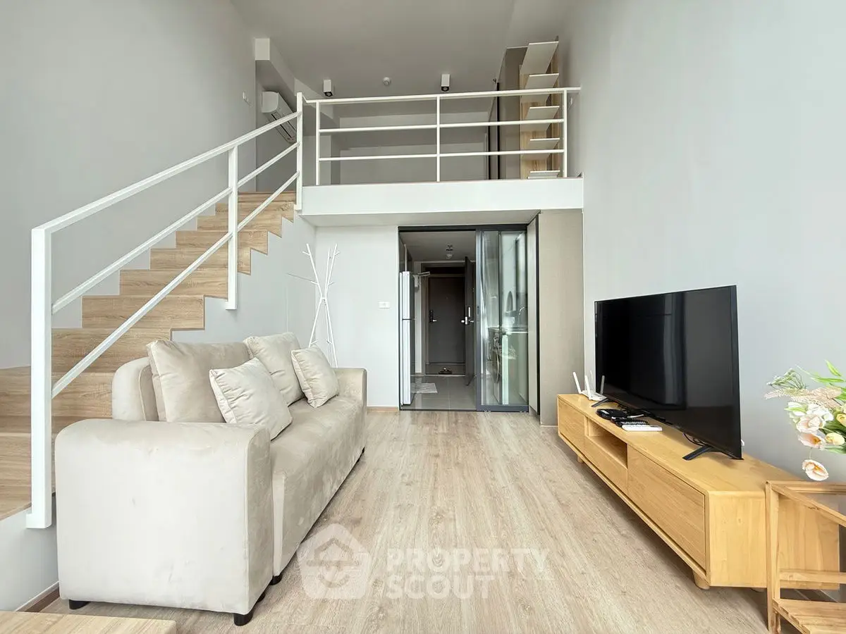 Modern loft-style living room with high ceiling and sleek design