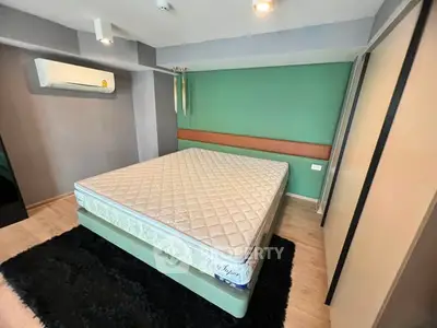 Modern bedroom with stylish decor and comfortable mattress in a cozy apartment.