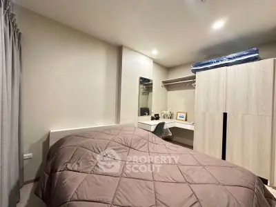 Cozy bedroom with modern furnishings and ample closet space