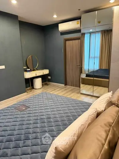Modern bedroom with mirrored wardrobe and stylish decor