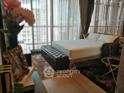 Luxurious bedroom with elegant decor and floor-to-ceiling windows