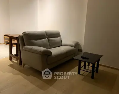 Cozy living room with modern sofa and coffee table, perfect for relaxation.
