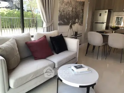Modern living room with elegant decor and open kitchen layout