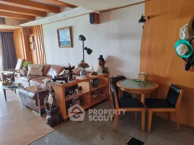 Spacious living room with elegant decor and cozy seating area