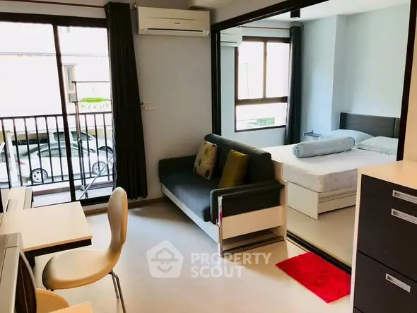 Modern studio apartment with balcony and stylish interior design