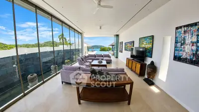 Luxurious living room with panoramic glass walls and stunning views, featuring modern decor and elegant furnishings.