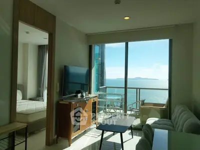 Stunning ocean view from modern living room with balcony in luxury apartment.