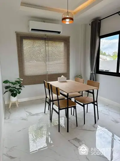 Modern dining area with natural light and stylish decor