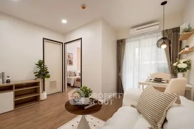 Charming living room with cozy decor and natural light, featuring a stylish sofa and elegant dining area.